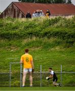 17 July 2020; Spectators watch on from outside the ground during the Down County Senior Football League Division 1A match between Clonduff and Kilcoo at Clonduff Park in Newry, Down. Competitive GAA matches have been approved to return following the guidelines of Northern Ireland’s COVID-19 recovery plan and protocols set down by the GAA governing authorities. With games having been suspended since March, competitive games can take place with updated protocols with only players, officials and essential personnel permitted to attend, social distancing, hand sanitisation and face masks being worn by those in attendance in an effort to contain the spread of the Coronavirus (COVID-19) pandemic. Photo by Sam Barnes/Sportsfile