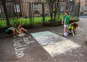 21 July 2020; Young residents at The Iveagh Trust Kevin Street in Dublin during a rememberance for Jack Charlton on the day of his funeral in Newcastle, England. The former Republic of Ireland manager Jack Charlton lead the Republic of Ireland team to their first major finals at UEFA Euro 1988, and subsequently the FIFA World Cup 1990, in Italy, and the FIFA World Cup 1994, in USA.  Photo by Stephen McCarthy/Sportsfile