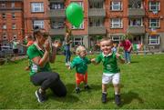 21 July 2020; Residents at The Iveagh Trust Kevin Street in Dublin, from left, Kristin Hawthorne Reid with her son Max and fellow Iveagh Trust Kevin Street resident Oscar Burton during a rememberance for Jack Charlton on the day of his funeral in Newcastle, England. The former Republic of Ireland manager Jack Charlton lead the Republic of Ireland team to their first major finals at UEFA Euro 1988, and subsequently the FIFA World Cup 1990, in Italy, and the FIFA World Cup 1994, in USA.  Photo by Stephen McCarthy/Sportsfile