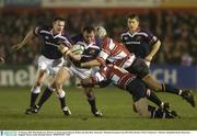 10 January 2004; Rob Henderson, Munster, in action against Duncan McRae and Jake Boer, Gloucester. Heineken European Cup 2003-2004, Round 3, Pool 5, Gloucester v Munster, Kingsholm Road, Gloucester, England. Picture credit; Brendan Moran / SPORTSFILE *EDI*