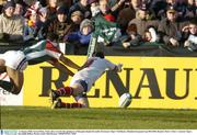 11 January 2004; Tyrone Howe, Ulster, dives over for the opening try of the game despite the tackle of Leicester Tigers' Neil Baxter. Heineken European Cup 2003-2004, Round 3, Pool 1, Ulster v Leicester Tigers, Ravenhill, Belfast. Picture credit; Matt Browne / SPORTSFILE *EDI*