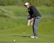 30 June 2013; Paul Casey, England, watches his eagle winning putt on the 18th green at the Irish Open Golf Championship 2013. Carton House, Maynooth, Co. Kildare. Picture credit: Matt Browne / SPORTSFILE