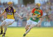29 June 2013; Hugh Patrick O'Byrne, Carlow, in action against Podge Doran, Wexford. GAA Hurling All-Ireland Senior Championship, Phase I, Wexford v Carlow, Wexford Park, Wexford. Picture credit: Matt Browne / SPORTSFILE