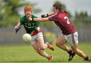 30 June 2013; Conor Byrne, Mayo, in action against Luke Burke, Galway. Electric Ireland Connacht GAA Football Minor Championship, Semi-Final, Galway v Mayo, Hyde Park, Roscommon. Picture credit: Barry Cregg / SPORTSFILE