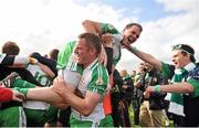 30 June 2013; Lorcan Mulvey, London, lifts team-mate Shane Mulligan, as they celebrate victory after the game. Connacht GAA Football Senior Championship, Semi-Final Replay, Leitrim v London, Hyde Park, Roscommon. Picture credit: Barry Cregg / SPORTSFILE