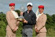 30 June 2013; Paul Casey, England, with the Irish Open Trophy and Emirates cabin crew members Sarah Jameson, left, and Natalia Marchetta, after the Irish Open Golf Championship 2013. Carton House, Maynooth, Co. Kildare. Picture credit: Matt Browne / SPORTSFILE