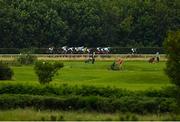 24 July 2020; A view of the field as they pass golfers playing at Down Royal Golf Club during the BoyleSports Irish EBF Ulster Oaks Fillies Handicap at Down Royal Racecourse in Lisburn, Down. Racing remains behind closed doors to the public under guidelines of the Irish Government in an effort to contain the spread of the Coronavirus (COVID-19) pandemic. Photo by Seb Daly/Sportsfile