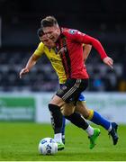 24 July 2020; Danny Grant of Bohemians in action against Karl Chambers of Longford Town during the club friendly match between Bohemians and Longford Town at Dalymount Park in Dublin. Soccer matches continue to take place in front of a limited number of people in an effort to contain the spread of the coronavirus (Covid-19) pandemic. Photo by Ramsey Cardy/Sportsfile