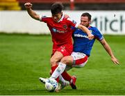 24 July 2020; Aaron Dobbs of Shelbourne is tackled by Jamie Mulgrew of Linfield during the club friendly match between Shelbourne and Linfield at Tolka Park in Dublin. Soccer matches continue to take place in front of a limited number of people in an effort to contain the spread of the coronavirus (Covid-19) pandemic. Photo by Harry Murphy/Sportsfile