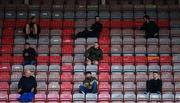 24 July 2020; Supporters sit socially distanced in The Jodi Stand during the club friendly match between Bohemians and Longford Town at Dalymount Park in Dublin. Soccer matches continue to take place in front of a limited number of people in an effort to contain the spread of the coronavirus (Covid-19) pandemic. Photo by Ramsey Cardy/Sportsfile