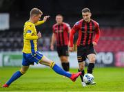 24 July 2020; Anto Breslin of Bohemians in action against James English of Longford Town during the club friendly match between Bohemians and Longford Town at Dalymount Park in Dublin. Soccer matches continue to take place in front of a limited number of people in an effort to contain the spread of the coronavirus (Covid-19) pandemic. Photo by Ramsey Cardy/Sportsfile