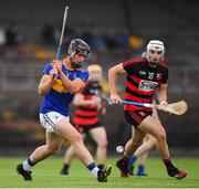 24 July 2020; Jake Beecher of Tallow in action against Dennie Hutchinson of Ballygunnar during the Waterford County Senior Hurling Championship Group A Round 1 match between Ballygunnar and Tallow at Fraher Field in Dungarvan, Waterford. GAA matches continue to take place in front of a limited number of people in an effort to contain the spread of the coronavirus (Covid-19) pandemic. Photo by Matt Browne/Sportsfile
