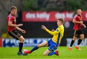 24 July 2020; JJ Lunney of Bohemians is tackled by James English of Longford Town during the club friendly match between Bohemians and Longford Town at Dalymount Park in Dublin. Soccer matches continue to take place in front of a limited number of people in an effort to contain the spread of the coronavirus (Covid-19) pandemic. Photo by Ramsey Cardy/Sportsfile