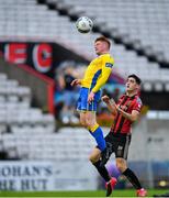 24 July 2020; Luke Dennison of Longford Town in action against Dawson Devoy of Bohemians during the club friendly match between Bohemians and Longford Town at Dalymount Park in Dublin. Soccer matches continue to take place in front of a limited number of people in an effort to contain the spread of the coronavirus (Covid-19) pandemic. Photo by Ramsey Cardy/Sportsfile