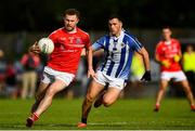 25 July 2020; Jack McCaffrey of Clontarf in action against Colm Basquel of Ballyboden St Enda's during the Dublin County Senior Football Championship Round 1 match between Ballyboden St Endas and Clontarf at Pairc Uí Mhurchu in Dublin. GAA matches continue to take place in front of a limited number of people in an effort to contain the spread of the Coronavirus (COVID-19) pandemic. Photo by David Fitzgerald/Sportsfile