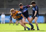 25 July 2020; Conor McHugh of Na Fianna in action against Kieran Doherty, left, and Oisin Lahiff of St Jude during the Dublin County Senior Football Championship Round 1 match between St Judes and Na Fianna at Parnell Park in Dublin. GAA matches continue to take place in front of a limited number of people in an effort to contain the spread of the Coronavirus (COVID-19) pandemic. Photo by Matt Browne/Sportsfile