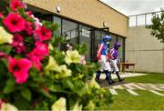 26 July 2020; Jockeys Chris Hayes, near, and Wayne Lordan, right, make their way to the parade ring prior to the Irish Stallion Farms EBF (C & G) Maiden at The Curragh Racecourse in Kildare. Racing remains behind closed doors to the public under guidelines of the Irish Government in an effort to contain the spread of the Coronavirus (COVID-19) pandemic. Photo by Seb Daly/Sportsfile