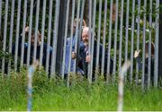 26 July 2020; Supporters look on through a fence from outside the ground during the Tipperary County Senior Hurling Championship Group 4 Round 1 match between Toomevara and Borris-Ileigh at McDonagh Park in Nenagh, Tipperary. GAA matches continue to take place in front of a limited number of people in an effort to contain the spread of the Coronavirus (COVID-19) pandemic. Photo by Piaras Ó Mídheach/Sportsfile