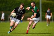 26 July 2020; Liam Og Murray of Magheracloone in action against Matthew McKenna  of Inniskeen during the Monaghan Senior Football Championship Group 1 Round 1 match between Inniskeen and Magheracloone in Inniskeen, Monaghan. GAA matches continue to take place in front of a limited number of people in an effort to contain the spread of the Coronavirus (COVID-19) pandemic. Photo by Philip Fitzpatrick/Sportsfile