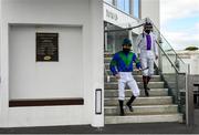 28 July 2020; Jockeys Gary Halpin, left, and Kevin Manning walk to the parade ring prior to the COLM QUINN BMW Irish EBF Fillies Maiden on day two of the Galway Summer Racing Festival at Ballybrit Racecourse in Galway. Horse racing remains behind closed doors to the public under guidelines of the Irish Government in an effort to contain the spread of the Coronavirus (COVID-19) pandemic. Photo by Harry Murphy/Sportsfile