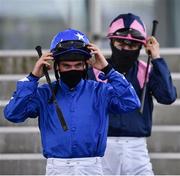 28 July 2020; Jockeys Gary Carroll, left, and Gary Halpin walk to the parade ring prior to the COLM QUINN BMW Mile Handicap on day two of the Galway Summer Racing Festival at Ballybrit Racecourse in Galway. Horse racing remains behind closed doors to the public under guidelines of the Irish Government in an effort to contain the spread of the Coronavirus (COVID-19) pandemic. Photo by Harry Murphy/Sportsfile