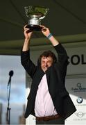 28 July 2020; Trainer Adrian McGuinness lifts the trophy after sending out Saltonstall to win the COLM QUINN BMW Mile Handicap on day two of the Galway Summer Racing Festival at Ballybrit Racecourse in Galway. Horse racing remains behind closed doors to the public under guidelines of the Irish Government in an effort to contain the spread of the Coronavirus (COVID-19) pandemic. Photo by Harry Murphy/Sportsfile