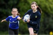 29 July 2020; Erin Steed, age 11, in action with Sophia Riordan, age 11, during the Bank of Ireland Leinster Rugby Summer Camp at KClondalkin RFC in Dublin. Photo by Matt Browne/Sportsfile