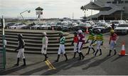 30 July 2020; Jockeys walk to the parade ring prior to the Guinness Galway Hurdle Handicap on day four of the Galway Summer Racing Festival at Ballybrit Racecourse in Galway. Horse racing remains behind closed doors to the public under guidelines of the Irish Government in an effort to contain the spread of the Coronavirus (COVID-19) pandemic. Photo by Harry Murphy/Sportsfile