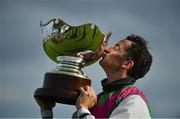 30 July 2020; Jockey Patrick Mullins celebrates with the trophy after victory in the Guinness Galway Hurdle Handicap on Aramon during day four of the Galway Summer Racing Festival at Ballybrit Racecourse in Galway. Horse racing remains behind closed doors to the public under guidelines of the Irish Government in an effort to contain the spread of the Coronavirus (COVID-19) pandemic. Photo by Harry Murphy/Sportsfile