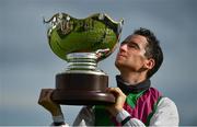30 July 2020; Jockey Patrick Mullins celebrates with the trophy after victory in the Guinness Galway Hurdle Handicap on Aramon during day four of the Galway Summer Racing Festival at Ballybrit Racecourse in Galway. Horse racing remains behind closed doors to the public under guidelines of the Irish Government in an effort to contain the spread of the Coronavirus (COVID-19) pandemic. Photo by Harry Murphy/Sportsfile