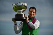 30 July 2020; Jockey Patrick Mullins celebrates with the trophy after victory in the Guinness Galway Hurdle Handicap on Aramon during day four of the Galway Summer Racing Festival at Ballybrit Racecourse in Galway. Horse racing remains behind closed doors to the public under guidelines of the Irish Government in an effort to contain the spread of the Coronavirus (COVID-19) pandemic. Photo by Harry Murphy/Sportsfile