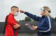 31 July 2020; Jack Malone of Derry City has his temperature taken by COVID-19 Compliance Officer Aileen McGuinness as he arrives prior to the SSE Airtricity League Premier Division match between Derry City and Sligo Rovers at the Ryan McBride Brandywell Stadium in Derry. The SSE Airtricity League Premier Division made its return today after 146 days in lockdown but behind closed doors due to the ongoing Coronavirus restrictions. Photo by Seb Daly/Sportsfile