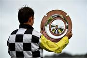 31 July 2020; Jockey Paul Townend lifts the Guinness Plate after winning the Guinness Galway Tribes Handicap Hurdle on Great White Shark on day five of the Galway Summer Racing Festival at Ballybrit Racecourse in Galway. Horse racing remains behind closed doors to the public under guidelines of the Irish Government in an effort to contain the spread of the Coronavirus (COVID-19) pandemic. Photo by Harry Murphy/Sportsfile