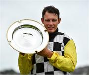 31 July 2020; Jockey Paul Townend lifts the Guinness Plate after winning the Guinness Galway Tribes Handicap Hurdle on Great White Shark on day five of the Galway Summer Racing Festival at Ballybrit Racecourse in Galway. Horse racing remains behind closed doors to the public under guidelines of the Irish Government in an effort to contain the spread of the Coronavirus (COVID-19) pandemic. Photo by Harry Murphy/Sportsfile