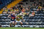 1 August 2020; Kevin O'Keeffe of Blackrock in action against Cian O'Connor of Erin's Own watched by the Blackrock substitutes in the stand during the Cork County Senior Hurling Championship Group B Round 1 match between Blackrock and Erin's Own at Páirc Uí Rinn  in Cork. GAA matches continue to take place in front of a limited number of people due to the ongoing Coronavirus restrictions. Photo by Brendan Moran/Sportsfile