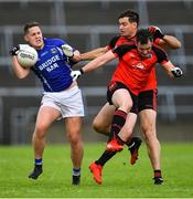 1 August 2020; Mark Hehir of Milltown fends off the tackles of Mícheál Ó Briain, centre, and Jack Ó Gaoithín of An Cheathrú Rua during the Galway County Senior Football Championship Group 4B Round 1 match between An Cheathrú Rua and Milltown at Pearse Stadium in Galway. GAA matches continue to take place in front of a limited number of people in an effort to contain the spread of the Coronavirus (COVID-19) pandemic. Photo by Piaras Ó Mídheach/Sportsfile