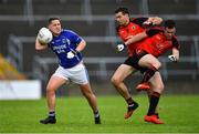 1 August 2020; Mark Hehir of Milltown looks on after fending off the tackles of Mícheál Ó Briain, centre, and Jack Ó Gaoithín of An Cheathrú Rua during the Galway County Senior Football Championship Group 4B Round 1 match between An Cheathrú Rua and Milltown at Pearse Stadium in Galway. GAA matches continue to take place in front of a limited number of people in an effort to contain the spread of the Coronavirus (COVID-19) pandemic. Photo by Piaras Ó Mídheach/Sportsfile