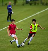 3 August 2020; Aidan Russell, red, in action against Trent Kone Doherty, yellow, during a Republic of Ireland Under 15s Assessment Day at the FAI National Training Centre at the Sport Ireland Campus in Dublin. Photo by Ramsey Cardy/Sportsfile