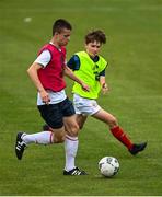 3 August 2020; Sean Hayden, red, in action against Brian Moore, yellow, during a Republic of Ireland Under 15s Assessment Day at the FAI National Training Centre at the Sport Ireland Campus in Dublin. Photo by Ramsey Cardy/Sportsfile
