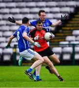 1 August 2020; Mícheál Ó Briain of An Cheathrú Rua in action against Damian Brennan, left, and Sean Blake of Milltown during the Galway County Senior Football Championship Group 4B Round 1 match between An Cheathrú Rua and Milltown at Pearse Stadium in Galway. GAA matches continue to take place in front of a limited number of people in an effort to contain the spread of the Coronavirus (COVID-19) pandemic. Photo by Piaras Ó Mídheach/Sportsfile