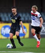 31 July 2020; Robbie Benson of St Patrick's Athletic is tackled by Greg Sloggett of Dundalk during the SSE Airtricity League Premier Division match between Dundalk and St Patrick's Athletic at Oriel Park in Dundalk, Louth. The SSE Airtricity League Premier Division made its return today after 146 days in lockdown but behind closed doors due to the ongoing Coronavirus restrictions. Photo by Piaras Ó Mídheach/Sportsfile