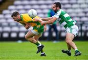 2 August 2020; Micheál Lundy of Corofin in action against Eddie O'Sullivan of Oughterard during the Galway County Senior Football Championship Group 4A Round 1 match between Corofin and Oughterard at Pearse Stadium in Galway. GAA matches continue to take place in front of a limited number of people due to the ongoing Coronavirus restrictions. Photo by Piaras Ó Mídheach/Sportsfile