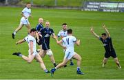 2 August 2020; Harry Rooney of Skryne shoots at goal, to score his side's second point, despite the efforts of Nicky O'Brien of Simonstown Gaels to block during the Meath County Senior Football Championship match between Simonstown Gaels and Skryne at Páirc Tailteann in Navan, Meath. GAA matches continue to take place in front of a limited number of people due to the ongoing Coronavirus restrictions. Photo by Ramsey Cardy/Sportsfile