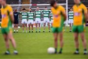 2 August 2020; Players stand for a minute's silence before the Galway County Senior Football Championship Group 4A Round 1 match between Corofin and Oughterard at Pearse Stadium in Galway. GAA matches continue to take place in front of a limited number of people due to the ongoing Coronavirus restrictions. Photo by Piaras Ó Mídheach/Sportsfile