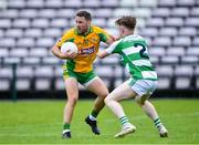 2 August 2020; Micheál Lundy of Corofin in action against Ciarán Hanley of Oughterard during the Galway County Senior Football Championship Group 4A Round 1 match between Corofin and Oughterard at Pearse Stadium in Galway. GAA matches continue to take place in front of a limited number of people due to the ongoing Coronavirus restrictions. Photo by Piaras Ó Mídheach/Sportsfile