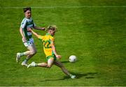 2 August 2020; Matthew Cooley of Corofin on his way to scoring side's seventh goal as Ciarán Hanley of Oughterard closes in during the Galway County Senior Football Championship Group 4A Round 1 match between Corofin and Oughterard at Pearse Stadium in Galway. GAA matches continue to take place in front of a limited number of people due to the ongoing Coronavirus restrictions. Photo by Piaras Ó Mídheach/Sportsfile