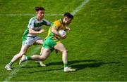 2 August 2020; Ian Burke of Corofin in action against Ciarán Hanley of Oughterard during the Galway County Senior Football Championship Group 4A Round 1 match between Corofin and Oughterard at Pearse Stadium in Galway. GAA matches continue to take place in front of a limited number of people due to the ongoing Coronavirus restrictions. Photo by Piaras Ó Mídheach/Sportsfile