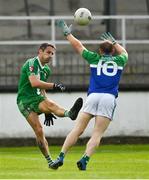 2 August 2020; Gary White of Sarsfields kicks a point despite the best efforts of Eoin O'Donoghue of Johnstownbridge during the Kildare Senior Football Championship Group C Round 1 match between Sarsfields and Johnstownbridge at St. Conleth’s Park in Newbridge, Kildare. GAA matches continue to take place in front of a limited number of people due to the ongoing Coronavirus restrictions. Photo by Brendan Moran/Sportsfile