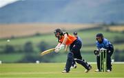 3 August 2020; Gaby Lewis of Scorchers plays a shot, watched by Typhoons wicket-keeper Amy Hunter, during the Women's Super Series match between Typhoons and Scorchers at Oak Hill Cricket Ground in Kilbride, Wicklow. Photo by Seb Daly/Sportsfile