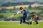 3 August 2020; Orla Prendergast of Typhoons plays a shot, watched by Scorchers wicket-keeper Shauna Kavanagh, during the Women's Super Series match between Typhoons and Scorchers at Oak Hill Cricket Ground in Kilbride, Wicklow. Photo by Seb Daly/Sportsfile